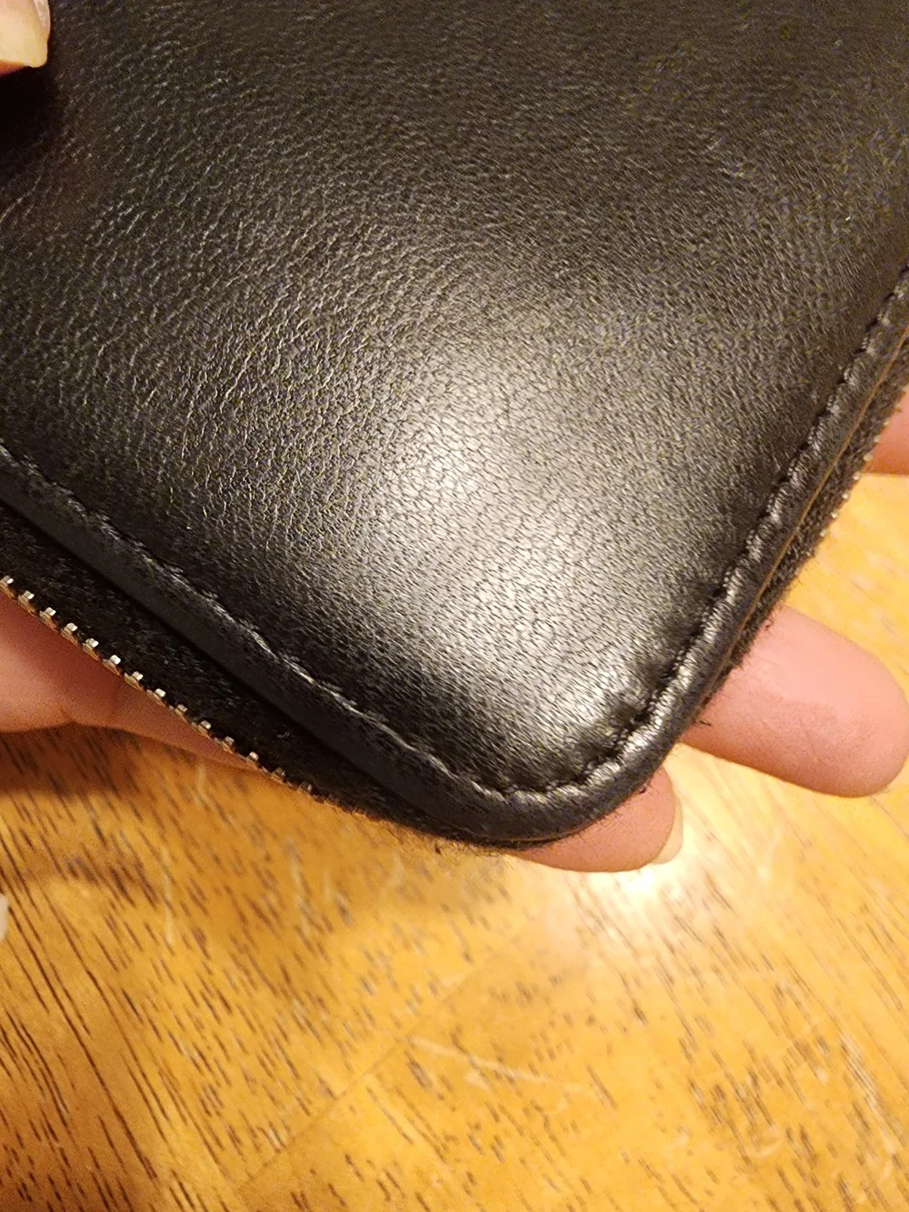 Chanel Timeless CC zip-around wallet features smooth black leather